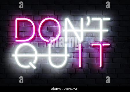 Do It Dont Quit Neon Sign on a dark wall Stock Photo
