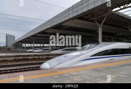 191226 -- NANCHANG, Dec. 26, 2019 -- Photo taken on Dec. 26, 2019 shows the first high-speed train G5025 leaving Nanchang West Station after the opening of Nanchang-Ganzhou high-speed railway in Nanchang, capital of east China s Jiangxi Province. A high-speed railway opened on Thursday threading Nanchang, capital of east China s Jiangxi Province, Jinggangshan, the cradle of the Chinese revolution, and China s rare earth base of Ganzhou. The high-speed railway with a design speed of 350 km per hour shortens the former train trip of more than 4 hours to less than 2 hours on the 418-km line.  CHI Stock Photo