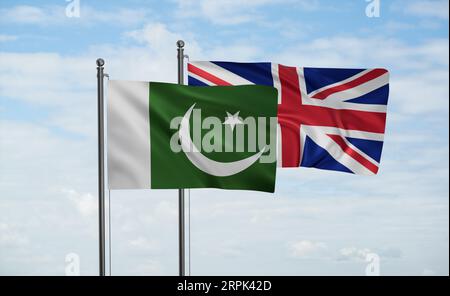 United Kingdom and Pakistan flag waving together in the wind on blue sky, two country cooperation concept Stock Photo