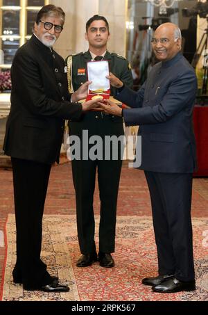 191230 -- NEW DELHI, Dec. 30, 2019 -- Indian President Ram Nath Kovind R presents Dadasaheb Phalke award to Indian superstar and veteran actor Amitabh Bachchan L during a function at the Indian presidential palace in New Delhi, India on Dec. 29, 2019. Amitabh Bachchan was Sunday honoured with the country s top cinema award -- Dadasaheb Phalke award for his outstanding contribution to the film industry, officials said. Str/Xinhua INDIA-NEW DELHI-AMITABH BACHCHAN-TOP CINEMA AWARD Stringer PUBLICATIONxNOTxINxCHN Stock Photo