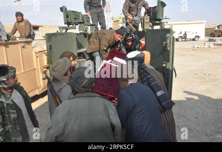 191230 -- SHIBERGHAN, Dec. 30, 2019 -- Afghan security force members ...