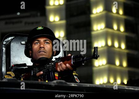 200101 -- DHAKA, Jan. 1, 2020 -- A member of Bangladesh s anti-crime elite force Rapid Action Battalion RAB stands guard with guns on the road in Dhaka, Bangladesh, Jan. 1, 2020. Bangladesh has tightened security in capital Dhaka in the run-up to New Year s Eve. Striking force and mobile teams will patrol sensitive Dhaka areas round-the-clock to avert any unpleasant incident. Str/Xinhua BANGLADESH-DHAKA-NEW YEAR S EVE-SECURITY-TIGHTENING Naim-ul-karim PUBLICATIONxNOTxINxCHN Stock Photo