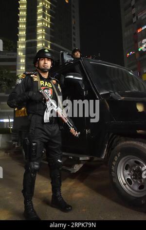 200101 -- DHAKA, Jan. 1, 2020 -- A member of Bangladesh s anti-crime elite force Rapid Action Battalion RAB stands guard with guns on the road in Dhaka, Bangladesh, Jan. 1, 2020. Bangladesh has tightened security in capital Dhaka in the run-up to New Year s Eve. Striking force and mobile teams will patrol sensitive Dhaka areas round-the-clock to avert any unpleasant incident. Str/Xinhua BANGLADESH-DHAKA-NEW YEAR S EVE-SECURITY-TIGHTENING Naim-ul-karim PUBLICATIONxNOTxINxCHN Stock Photo