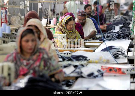 200103 -- KARACHI, Jan. 3, 2020 -- Laborers work in a garment factory in southern Pakistani port city of Karachi on Nov. 27, 2019. According to the Pakistani government, the textile industry contributes nearly 60 percent to the country s total exports, rendering it the major industrial sector of Pakistan which plays an important role in the economic growth of the country. TO GO WITH Spotlight: Pakistani industrialists envisage Chinese collaboration to modernize growing textile industry, boost export Str/Xinhua PAKISTAN-KARACHI-GARMENT-FACTORY Stringer PUBLICATIONxNOTxINxCHN