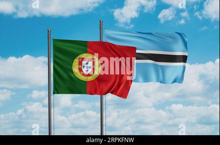 Portugal and Botswana flags waving together in the wind on blue cloudy ...