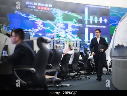 200111 -- WUHAN, Jan. 11, 2020 -- Li Song R, a train dispatcher, is seen at the dispatching hall of China Railway Wuhan Group Co., Ltd. in central China s Hubei Province, Jan. 7, 2020. China, the world s most populated country, on Jan. 10 ushered in its largest annual migration, 15 days ahead of the Spring Festival, or the Lunar New Year. This year, three billion trips will be made during the travel rush from Jan. 10 to Feb. 18 for family reunions and travel, according to official forecast. The 40-day travel rush is known as Chunyun in Chinese. The Lunar New Year falls on Jan. 25 this year, ea Stock Photo