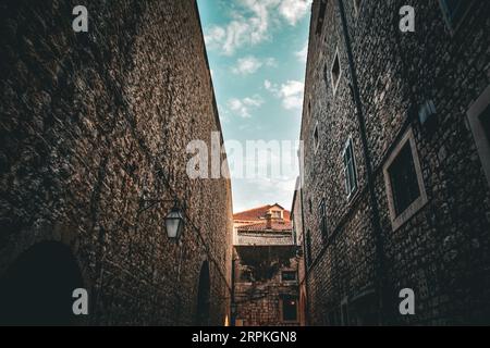 A Narrow Path between the Stone Walls of Medieval Dubrovnik - Croatia Stock Photo