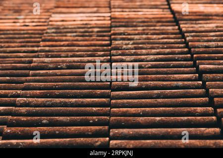 Old rustic terracotta roof tiles pattern as background, architectural detail from Lovran, Croatia Stock Photo