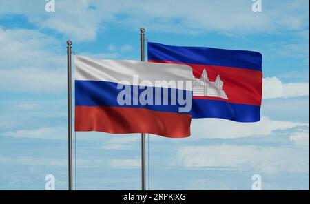 Cambodia flag and Russia flag waving together on blue sky, two country cooperation concept Stock Photo