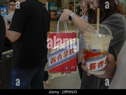 Luckin Coffee, the domestic coffee chain house, collaborates with liquor maker Kweichow Moutai, in developing the first Moutai-flavored coffee, drawin Stock Photo