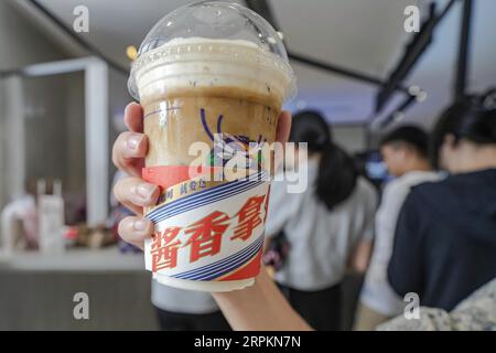 Luckin Coffee, the domestic coffee chain house, collaborates with liquor maker Kweichow Moutai, in developing the first Moutai-flavored coffee, drawin Stock Photo