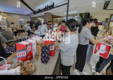 Luckin Coffee, the domestic coffee chain house, collaborates with liquor maker Kweichow Moutai, in developing the first Moutai-flavored coffee, drawin Stock Photo