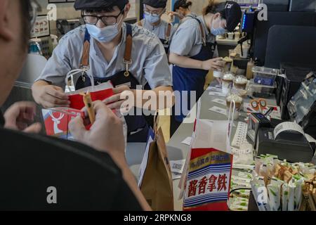 Luckin Coffee, the domestic coffee chain house, collaborates with liquor maker Kweichow Moutai, in developing the first Moutai-flavored coffee, drawin Stock Photo