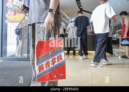 Luckin Coffee, the domestic coffee chain house, collaborates with liquor maker Kweichow Moutai, in developing the first Moutai-flavored coffee, drawin Stock Photo