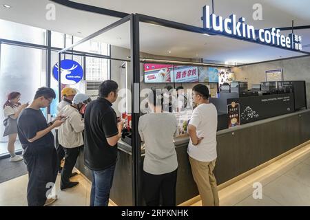 Luckin Coffee, the domestic coffee chain house, collaborates with liquor maker Kweichow Moutai, in developing the first Moutai-flavored coffee, drawin Stock Photo