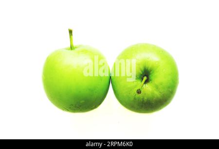 two wet green apples isolated Stock Photo