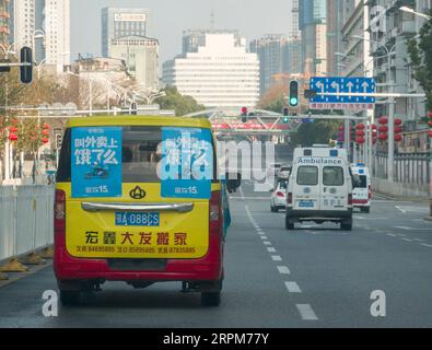 200201 -- WUHAN, Feb. 1, 2020 -- A van deliverying takeaways runs on the street in Wuhan, central China s Hubei Province, Jan. 31, 2020. In the middle of a severe epidemic, Wuhan in central China s Hubei Province lost the hustle and bustle of the past, with few cars and pedestrians on the roads. For the people staying at home to avoid the infection of novel coronavirus, the takeaway deliverymen in the city have become the bridge between them and the outside world. Yang Hu, a senior deliveryman of Eleme , Alibaba s flagship takeaway-ordering app, is in charge of the delivery orders of Zhongjia Stock Photo