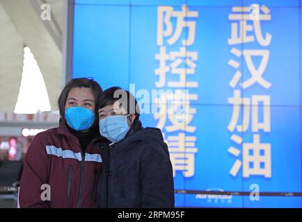 200204 -- SHENYANG, Feb. 4, 2020 -- Medical staff from the First Hospital of China Medical University pose for a photo at Shenyang Taoxian International Airport in Shenyang, capital of northeast China s Liaoning Province, Feb. 4, 2020. A medical team of Liaoning, comprised of 34 medical and administrative members from the First Hospital of China Medical University, 10 medical members from Shengjing Hospital of China Medical University and two support workers from China Medical University School and Hospital of Stomatology, set off on Tuesday at Shenyang Taoxian International Airport to aid the Stock Photo