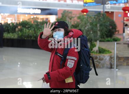 200204 -- SHENYANG, Feb. 4, 2020 -- A medical staff from Shengjing Hospital of China Medical University waves at Shenyang Taoxian International Airport in Shenyang, capital of northeast China s Liaoning Province, Feb. 4, 2020. A medical team of Liaoning, comprised of 34 medical and administrative members from the First Hospital of China Medical University, 10 medical members from Shengjing Hospital of China Medical University and two support workers from China Medical University School and Hospital of Stomatology, set off on Tuesday at Shenyang Taoxian International Airport to aid the coronavi Stock Photo