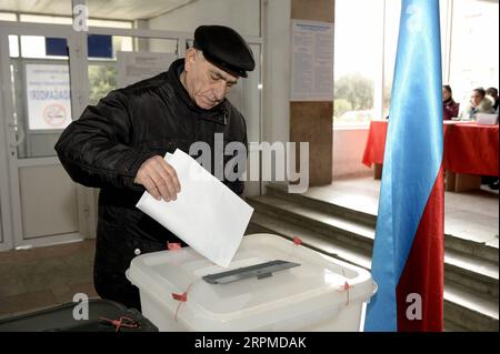 200209 -- BAKU, Feb. 9, 2020 -- A man casts his vote at a polling station in Baku, Azerbaijan, Feb. 9, 2020. Azerbaijan started a snap parliamentary election on Sunday morning in a bid to renew its dissolved 125-member National Assembly. Photo by Tofik Babayev/Xinhua AZERBAIJAN-BAKU-PARLIAMENTARY ELECTION LixMing PUBLICATIONxNOTxINxCHN Stock Photo