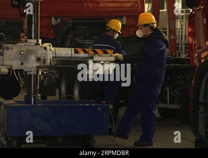 200209 -- BEIJING, Feb. 9, 2020 -- Staff members work at a production line of Zoomlion Fire Machinery Co., Ltd. in Changsha, central China s Hunan Province, Feb. 5, 2020. Xinhua Headlines: China shores up businesses while combating virus outbreak XuexYuge PUBLICATIONxNOTxINxCHN Stock Photo