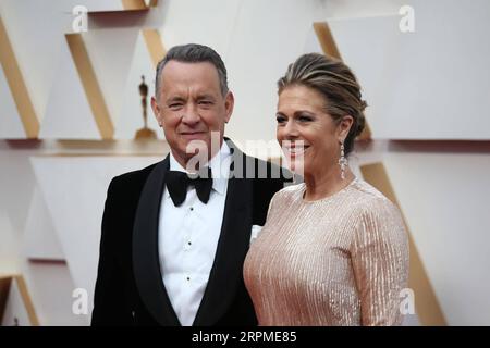 200210 -- LOS ANGELES, Feb. 10, 2020 -- Tom Hanks L and Rita Wilson arrive for the red carpet of the 92nd Academy Awards at the Dolby Theatre in Los Angeles, the United States, Feb. 9, 2020.  U.S.-LOS ANGELES-OSCARS-RED CARPET LixYing PUBLICATIONxNOTxINxCHN Stock Photo