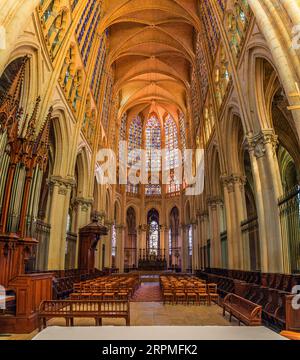 Tours, France, Europe - September 4, 2023: Wide view of the altar inside the Saint Gatien Cathedral of Tours, with brightly coloured stained glass win Stock Photo