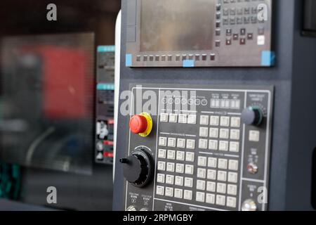 Remote control console of CNC machining center. Selective focus. Stock Photo