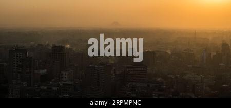 200216 -- CAIRO, Feb. 16, 2020 -- A view of the Giza Pyramids and buildings in Giza province is seen from the Cairo Tower in Cairo, Egypt, Nov. 24, 2019. Due to an outbreak of the novel coronavirus pneumonia, which originated in China s central city of Wuhan late last year, many Chinese tourists who had planned to travel abroad during the week-long Spring Festival holiday chose instead to stay at home. Despite the apparent impact from the declining number of Chinese visitors right now, the Egyptian people have expressed their confidence in China s ability to overcome the disease and voiced hop Stock Photo