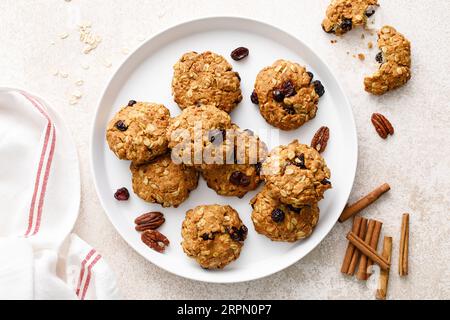 Oatmeal cranberry healthy homemade cookies with cinnamon and pecan nuts for breakfast Stock Photo