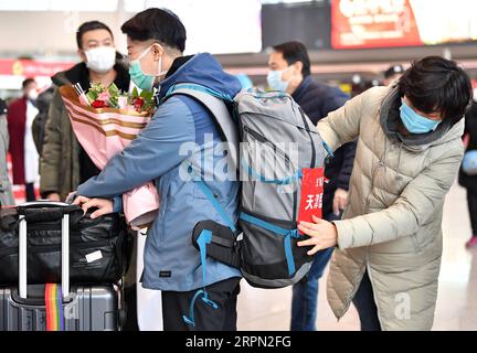 200220 -- TIANJIN, Feb. 20, 2020 -- Medical team members prepare to leave for Hubei Province at Binhai International Airport in Tianjin, north China, Feb. 20, 2020. The 11th batch of medical team comprised of 172 medical personnel from Tianjin set off on Thursday to aid the coronavirus control efforts in Hubei. Previously a total of 1,073 medical workers from Tianjin have assisted Hubei in the anti-virus fight.  CHINA-TIANJIN-NCP-MEDICAL TEAM-AID CN LixRan PUBLICATIONxNOTxINxCHN Stock Photo