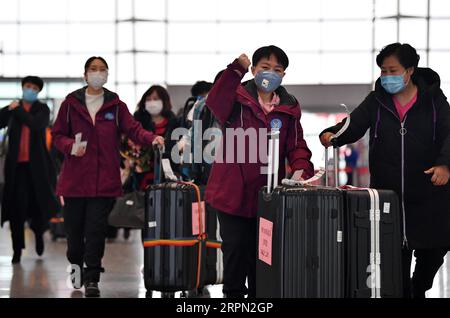 200220 -- TIANJIN, Feb. 20, 2020 -- Medical team members prepare to leave for Hubei Province at Binhai International Airport in Tianjin, north China, Feb. 20, 2020. The 11th batch of medical team comprised of 172 medical personnel from Tianjin set off on Thursday to aid the coronavirus control efforts in Hubei. Previously a total of 1,073 medical workers from Tianjin have assisted Hubei in the anti-virus fight.  CHINA-TIANJIN-NCP-MEDICAL TEAM-AID CN LixRan PUBLICATIONxNOTxINxCHN Stock Photo
