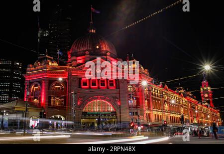 200222 -- SYDNEY, Feb. 22, 2020 -- Flinders Street Station is lit up in red in Melbourne, Australia, Feb. 21, 2020. As China is fighting the outbreak of COVID-19, the Victorian state government of Australia launched a new campaign on Thursday to show their support for the Chinese communities at home and abroad. As part of the campaign, a number of Victoria landmarks, including the Arts Center, National Gallery of Victoria, Melbourne Museum, Melbourne Town Hall and Flinders Street Station, were be lit up in red and gold on Friday as a symbol of solidarity with Chinese Victorians.  AUSTRALIA-MEL Stock Photo