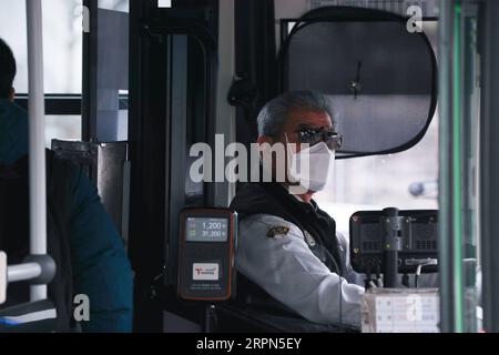 200223 -- BEIJING, Feb. 23, 2020 -- A bus driver is seen at a stop in Jongno district of Seoul, South Korea, Feb. 21, 2020. South Korea confirmed 142 more cases of the COVID-19 on Saturday, raising the total number of infections to 346.  XINHUA PHOTOS OF THE DAY WangxJingqiang PUBLICATIONxNOTxINxCHN Stock Photo