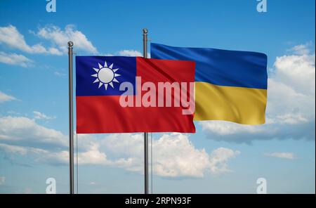 Ukraine and Taiwan flag waving together in the wind on blue sky, two country cooperation concept Stock Photo