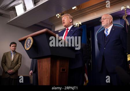 200229 -- WASHINGTON, Feb. 29, 2020 -- U.S. President Donald Trump C attends a press conference at the White House in Washington D.C., the United States, on Feb. 29, 2020. The United States on Saturday announced additional travel restrictions on Iran and raised travel advisories for certain areas of Italy and South Korea over coronavirus concerns.  U.S.-WASHINGTON D.C.-PRESS CONFERENCE-CORONAVIRUS LiuxJie PUBLICATIONxNOTxINxCHN Stock Photo