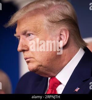 200229 -- WASHINGTON, Feb. 29, 2020 -- U.S. President Donald Trump attends a press conference at the White House in Washington D.C., the United States, on Feb. 29, 2020. The United States on Saturday announced additional travel restrictions on Iran and raised travel advisories for certain areas of Italy and South Korea over coronavirus concerns.  U.S.-WASHINGTON D.C.-PRESS CONFERENCE-CORONAVIRUS LiuxJie PUBLICATIONxNOTxINxCHN Stock Photo