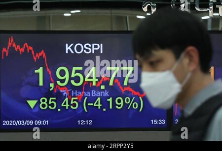 200309 -- SEOUL, March 9, 2020 -- A staff member wearing face mask works at a bank in Seoul, South Korea, March 9, 2020. South Korea confirmed 96 more cases of the COVID-19 on Monday, raising the total number of infections to 7,478. NEWSIS/Handout via Xinhua SOUTH KOREA-COVID-19-CONFIRMED CASES WangxJingqiang PUBLICATIONxNOTxINxCHN Stock Photo