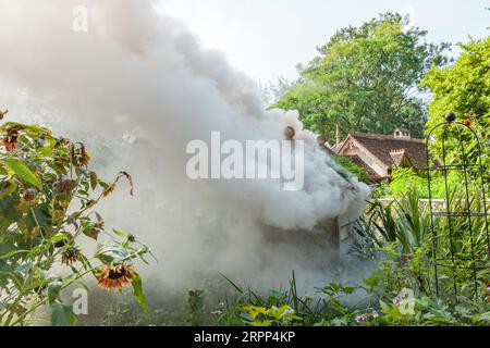 St James's Park, London, UK. 5th September 2023. A Bug Hotel in the grounds of Duck Island Cottage, St James's Park, London engulfed in smoke after a fire broke out in the 2016 construction.  A woman was taken in for questioning after being suspected of deliberately starting the fire.  Photo by Amanda Rose/Alamy Live News Stock Photo