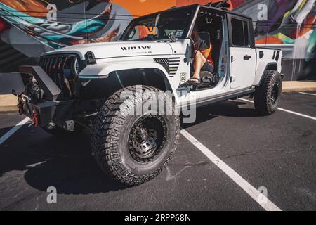 Side of Jeep Gladiator in front of Graffiti Wall Stock Photo