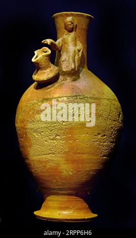 Jug with attached decoration figures on shoulder Red slip and Bichrome ...