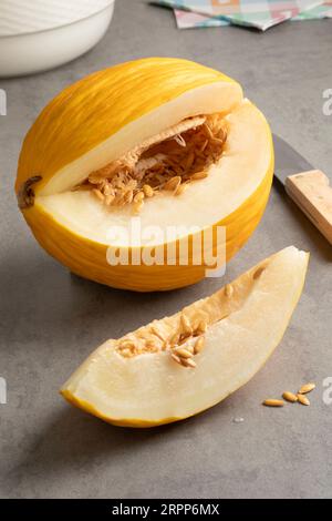 Fresh ripe yellow Honeydew melon and a wedge close up Stock Photo