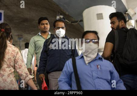 200313 -- NEW DELHI, March 13, 2020 -- People wearing masks are seen at a metro station in New Delhi, India, March 13, 2020. The number of the COVID-19 cases in India Friday rose to 81, India s federal health ministry officials said.  INDIA-NEW DELHI-COVID-19-CONFIRMED CASES JavedxDar PUBLICATIONxNOTxINxCHN Stock Photo