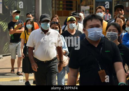 200314 -- KUALA LUMPUR, March 14, 2020 Xinhua -- People wearing masks walk on a street in Kuala Lumpur, Malaysia, March 14, 2020. Malaysia on Saturday announced 41 new cases of COVID-19, bringing the total number in the country to 238. Xinhua/Chong Voon Chung MALAYSIA-KUALA LUMPUR-COVID-19-CASES PUBLICATIONxNOTxINxCHN Stock Photo