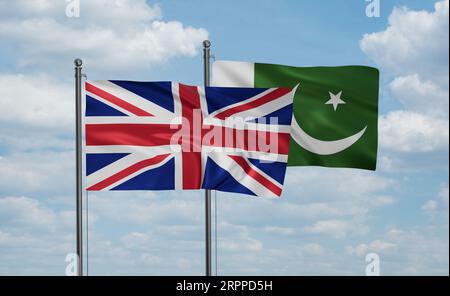 Pakistan flag and United Kingdoms, UK, Great Britain flag waving together on blue sky, two country cooperation concept Stock Photo