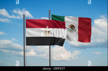 Egypt flag and Mexico flag waving together on blue sky, two country ...