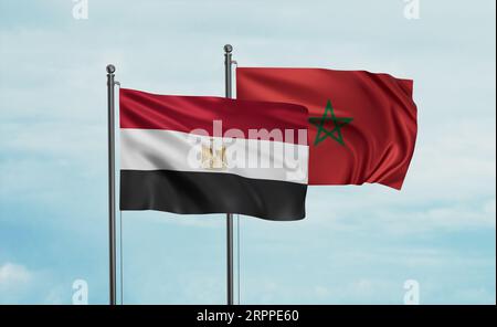 Morocco flag and Egypt flag waving together on blue sky, two country cooperation concept Stock Photo