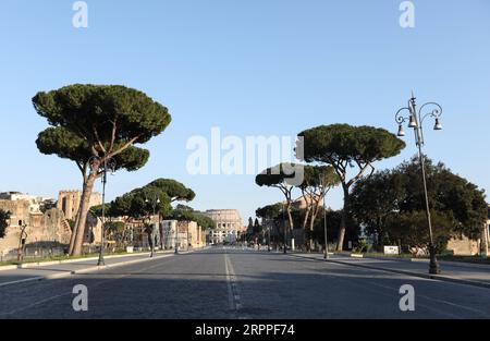 200317 -- ROME, March 17, 2020 -- Few people walk on Via del Fori Imperiali in Rome, Italy, on March 16, 2020. Italy s accumulated number of confirmed cases rose to 27,980 on Monday from the tally of 24,747 on the previous day.  ITALY-ROME-COVID-19-LOCKDOWN ChengxTingting PUBLICATIONxNOTxINxCHN Stock Photo