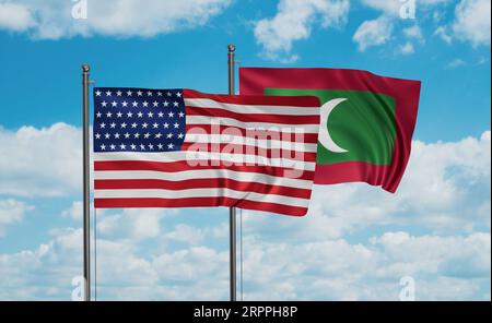 USA and Maldives flags waving together in the wind on blue cloudy sky ...