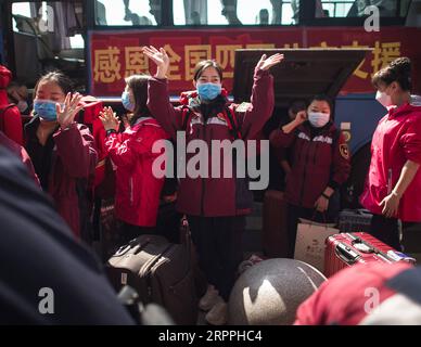 200318 -- WUHAN, March 18, 2020 -- Medics from southwest China s Guizhou Province bid farewell at Wuhan Railway Station in Wuhan, central China s Hubei Province, March 17, 2020. Medical assistance teams started leaving Hubei Province early on Tuesday as the epidemic outbreak in the hard-hit province has been subdued.  CHINA-WUHAN-MEDICS-DEPARTURE-FAREWELL CN XiaoxYijiu PUBLICATIONxNOTxINxCHN Stock Photo